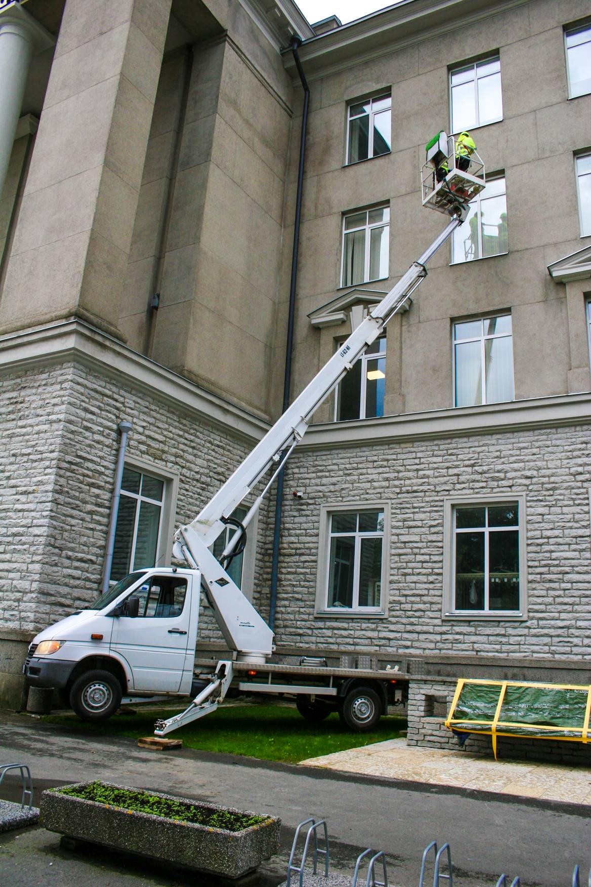 Window cleaning from basket hoist